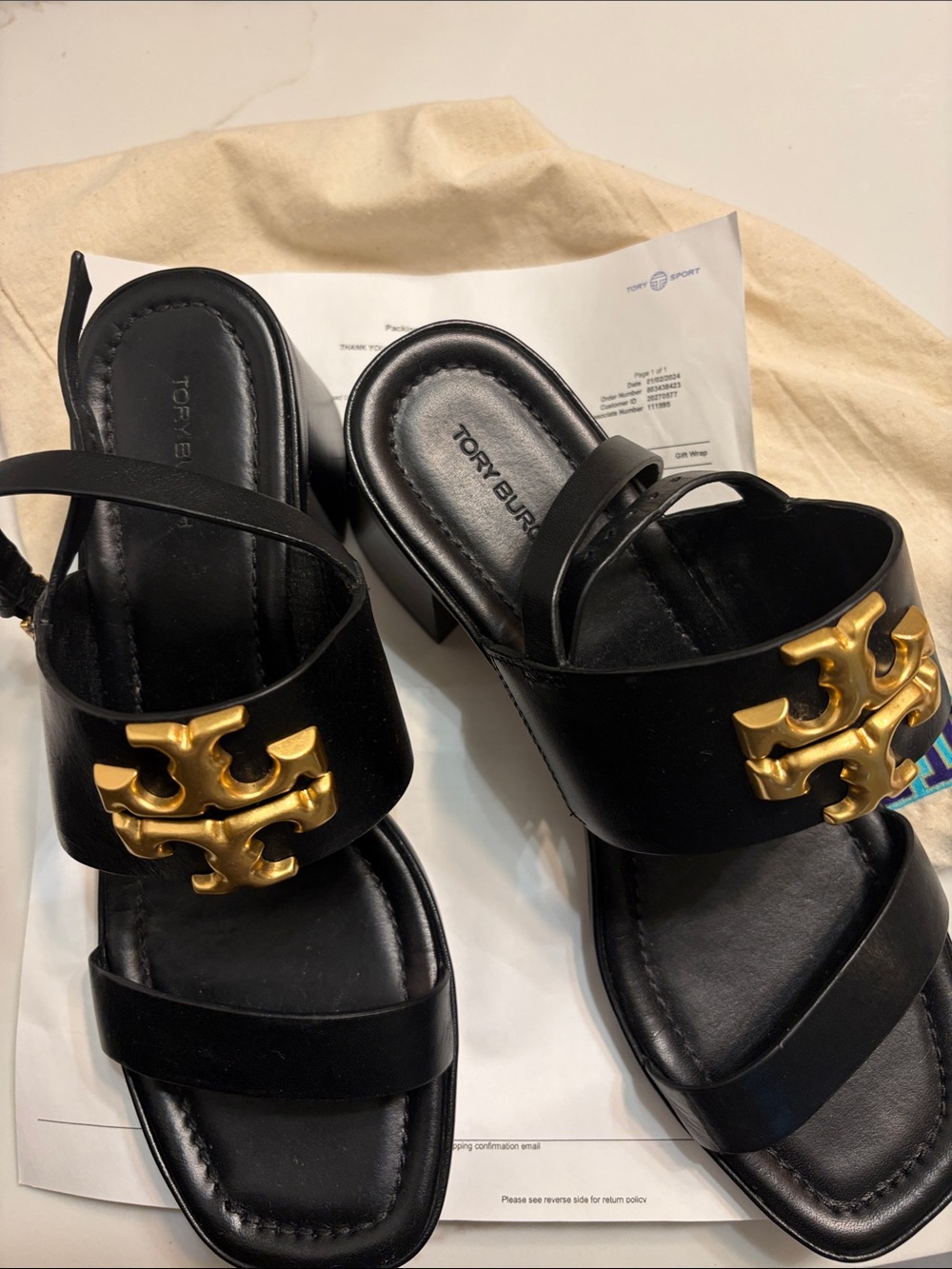 Tory Burch Black Leather Mules with Gold Logo Accent